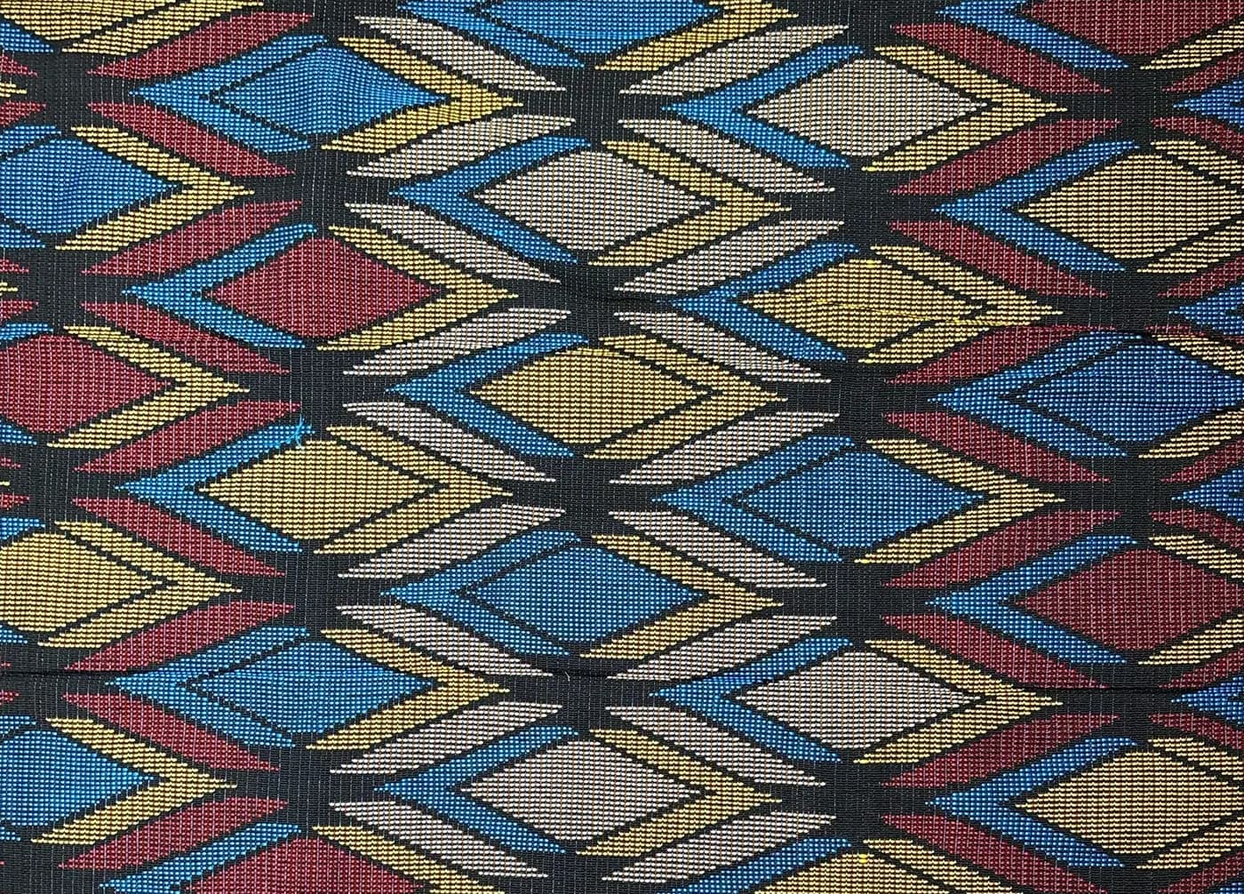 Close-up of an Akwete cloth: diamonds and chevrons in blue, gold, red and white on black